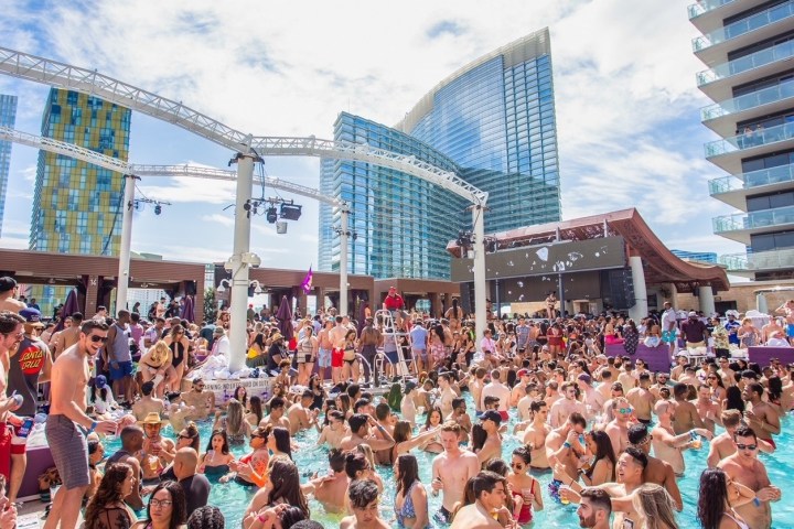 a large crowd of people in a swimming pool